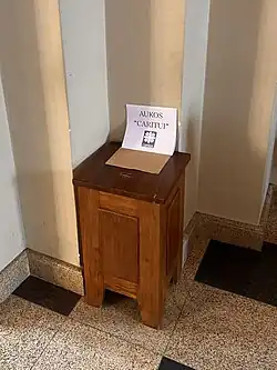 Donation box for Caritas in the Kaunas Cathedral Basilica.}