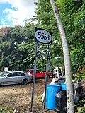 Sign for PR-5568 in Padilla, Corozal, heading north