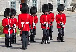 The Royal 22nd Regiment of Canada unfixing their bayonets.