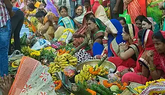 Women waiting with prasada for offerings