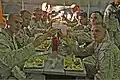 Marines of Combat Logistics Battalion 6, 2nd Marine Logistics Group, based out of Camp Lejeune, N.C., toast in celebration of their completion of the Integrated Training Exercise during their "Warrior Night" at Twentynine Palms, Calif., 6 June 2013.