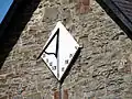 Close-up of the sundial on Llanfihangel y Creuddyn church.