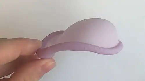 The rim is strongly concave on the same side that the main bowl is concave. The cup is bilaterally symmetric.