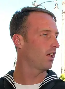 Casey Tibbs wearing a U.S. Navy Sailors uniform