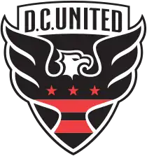 A shield with stylized black eagle facing right with three red stars and two red strips across its chest, and the words "D.C. UNITED" above.