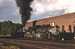 Two DRGW locomotives waiting to be serviced at the Chama engine house, 1967.