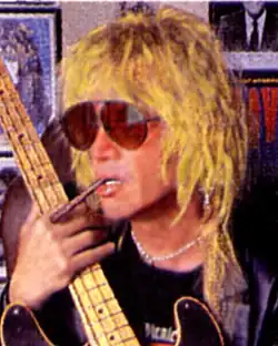 Danny Sheridan with his 1951 Fender Precision Bass in a photograph that appeared in Bass Player Magazine,[1] October 2001. (Photo by Carol Sheridan. Used with permission)