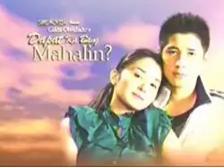 An image of Kris Bernal and Aljur Abrenica, with a sky and clouds in the background. The series title is displayed on the left side of the image.