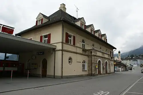 Three-story building with hip roof and dormers