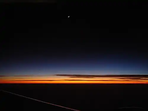 Astronomical twilight as seen from a plane window