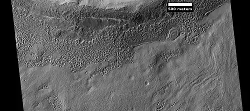 Small, layered structure, as seen by HiRISE under the HiWish program. Picture also shows brain terrain forming.
