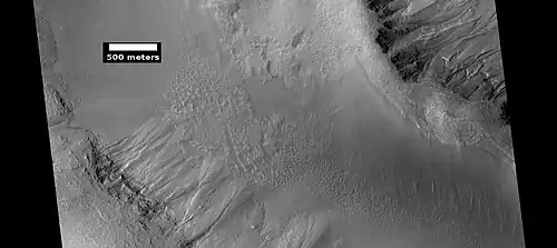 Gullies in two levels of a crater wall, as seen by HiRISE under HiWish program. Gullies at two levels suggests they were not made with an aquifer, as was first suggested. Location is Phaethontis quadrangle.