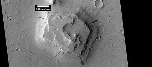 Dark slope streaks on layered mesa, as seen by HiRISE under HiWish program