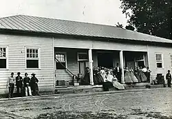 Arsenal employees posing in front of the building before the explosion