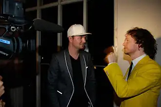 Torpe (right) and Kolsch/Rune RK (left) being interviewed backstage at a show in Copenhagen, Denmark on May 30, 2008.