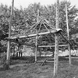 The structure of a barrack; the holes in the post are elevations where pins can be placed as the roof is raised and lowered