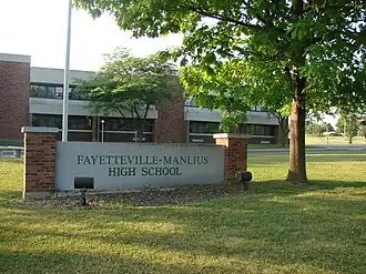 The front of the high school, facing south onto Route 173.