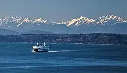 Ferry on Puget Sound. Left to right: Mt. Pershing, Jefferson Peak, Mt. Cruiser, Mt. Skokomish, Mt. Stone