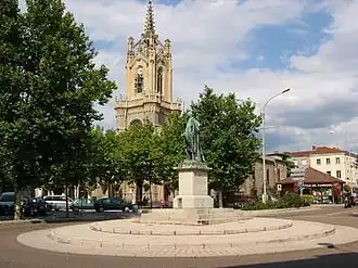 The church with a statue of Michel Combe, a commander of the French Foreign Legion