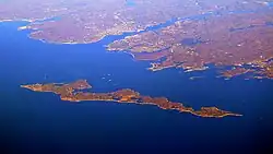 Fishers Island with the coast of Groton, Connecticut in the background.