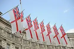 Admiralty Arch is customarily decorated with White Ensigns on state occasions.