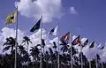 Flags outside Singapore International Airport, photographed February 1969 × July 1971.