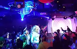 Photograph of a person entertaining a crowd