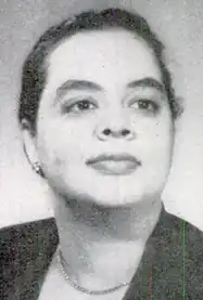 A Black woman with hair dressed back to the nape