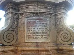 Inscription below lion