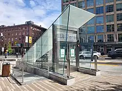 An angular glass subway entrance