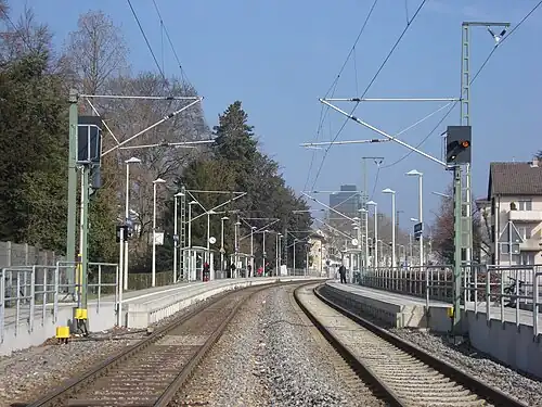 Double-tracked railway line with side platforms