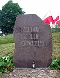 Monument to the victims of Augustów chase in Giby, reading: "Died for being Poles"