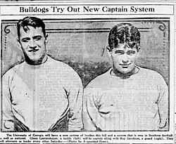 Black and white figure of two well-built men