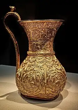Gold ewer of the Buyid Period, mentioning Buyid ruler Izz al-Dawla Bakhtiyar ibn Mu'izz al-Dawla, 966-977 CE, Iran.[168]
