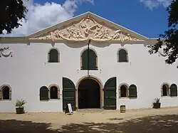 Cloete Cellar building, the original wine cellar at the estate. The pediment gable is by the sculptor Anton Anreith.