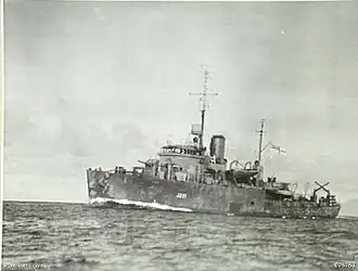 HMAS Geelong traveling at full speed while escorting a convoy off New Guinea in September 1944
