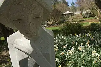 A sculpture by Frank Lloyd Wright greets garden visitors.