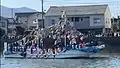 Boat carrying men in fundoshi during Horan-enya