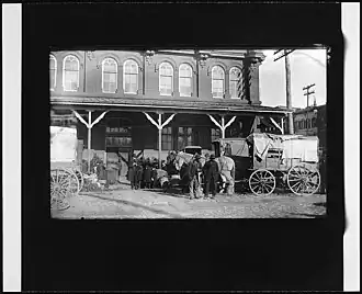 Horse-drawn wagons at the corner of B Street NW and 7th Street NW