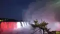 A view of Horseshoe Falls with the Canadian flag at night