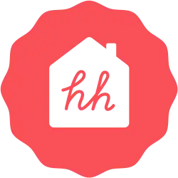 A red, radial geometric shape with a 2D white house in the centre bearing two red lowercase letters "hh"