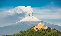 Iglesia de Nuestra Señora de los Remedios atop Great Pyramid (Tlalchihualtépetl) in Cholula, Puebla, with the volcano in the background