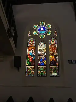 One of the stained glass windows of the Martin Luther Church, depicting Pentecost, produced by the Conrad House