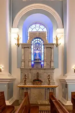 An altar with an image of Our Lady of Conception
