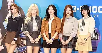 The five members of Itzy at an event for watches