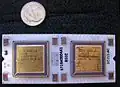 Top side of J-11 microprocessor hybrid. DC335 control chip on left, DC334 data path chip on right. US dime for scale.
