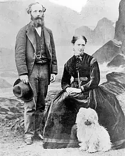 An image showing Katherine Clerk Maxwell (seated), with her husband James Clerk Maxwell and one of the couple's terriers.