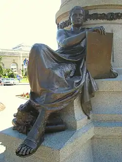 One of three sculptures on the pedestal