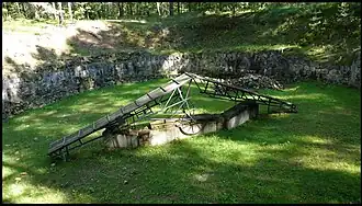 Pit used to burn corpses that were exhumed to destroy evidence of mass murders.