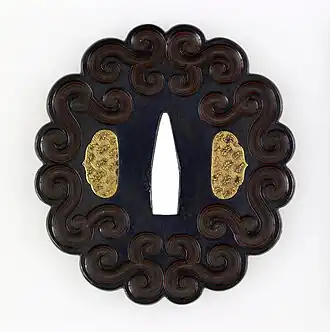 Japanese tsuba with geometric scrollwork design, not imitating plant forms, unknown date, shakudo and gold, Walters Art Museum, Baltimore, US